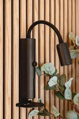 a black speaker is attached to a wall at Dinbnb Apartments I Explore Bergen! I 650m To Bryggen I Easy Check-in in Bergen