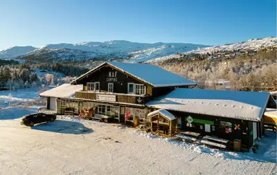 a large building with snow on the ground at 3 Bedroom Amazing Home In Tysse in Tysse
