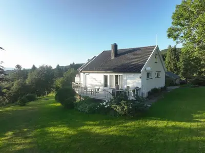 a white house with a large green yard at Et helt hus i fredelige omgivelser med utsikt! ca 10 min fra Trondheim sentrum in Trondheim