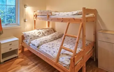 a bedroom with two bunk beds in a room at 2 Bedroom Nice Home In Skatval in Tilleraune