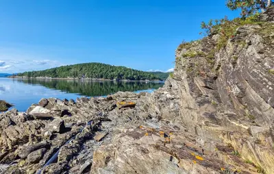 a rocky shore with a body of water at 2 Bedroom Nice Home In Skatval in Tilleraune