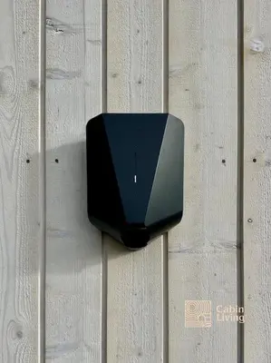 a black object on the side of a wall at New large cabin with sauna in Hafjell in Nordseter