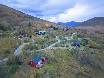 an aerial view of a house on a hill at Peaceful cabin retreat in the Norwegian mountains in Ulsteinvik