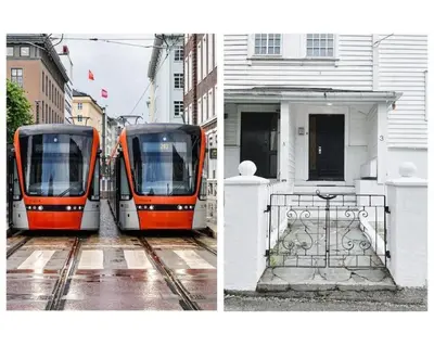 two trains are parked next to a building at Apartment with Loft & Window Balcony, Free parking in Bergen