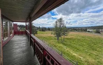 a balcony of a house with a view of a field at Nice Home In Lillehammer With Sauna in Lillehammer