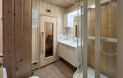 a bathroom with a shower and a sink at Nice Home In Lillehammer With Sauna in Lillehammer