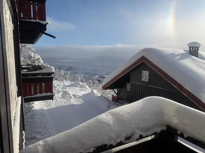 a snow covered roof of a building with snow on it at Steps From The Slopes With Stunning Views! in Beitostøl