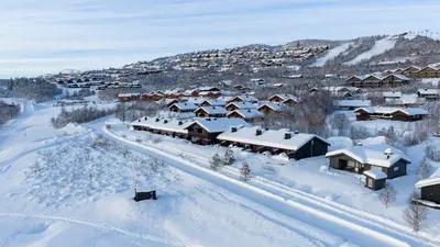 an aerial view of a village covered in snow at Perfect Retreat for Small Families in Beitostøl