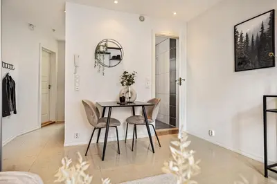 a dining room with a table and chairs at Charming apartment in Sandviken in Bergen