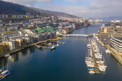 an aerial view of a harbor with boats in the water at Modern Apartment with Rooftop Terrace and Stunning Views in Bergen