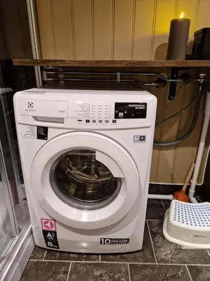 a washing machine in a small room with at Gaustablikk, 3 soverom, fri utsikt til fjell og innsjø in Gaustablikk