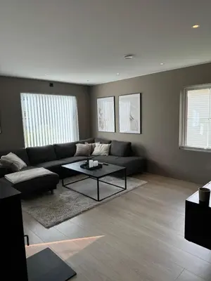 a living room with a couch and a coffee table at Big 2 bedrooms apartment 10 min from Granåsen, VM2025 in Trondheim