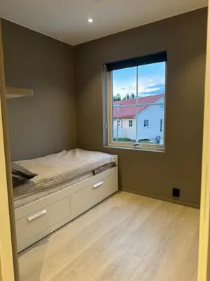 a bedroom with a bed and a window at Big 2 bedrooms apartment 10 min from Granåsen, VM2025 in Trondheim