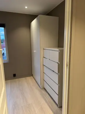 an empty room with a closet with a refrigerator at Big 2 bedrooms apartment 10 min from Granåsen, VM2025 in Trondheim