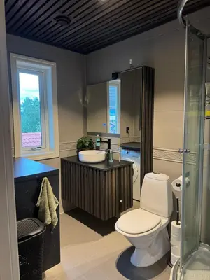 a bathroom with a toilet and a sink and a shower at Big 2 bedrooms apartment 10 min from Granåsen, VM2025 in Trondheim