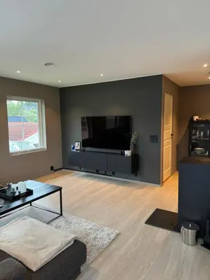 a living room with a large flat screen tv at Big 2 bedrooms apartment 10 min from Granåsen, VM2025 in Trondheim