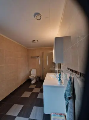 a bathroom with a sink and a toilet at Trysil sentrum leilighet in Trysil