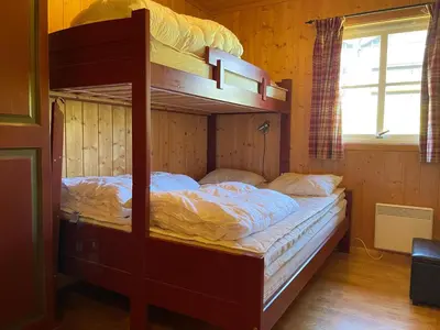 a bunk bed in a room with a bunk bed at Cozy 3-Bedroom Apartment Near Beitostølen Ski in Beitostøl