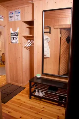 a bathroom with a mirror and a table in a room at Koselig familiehytte på Rømåsen in Ringsaker
