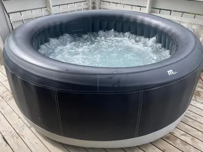 a large circular hot tub on a deck at Presthusvegen in Trondheim