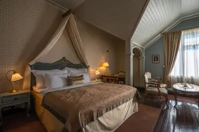 a bedroom with a large bed with a canopy at Jervell 2 BnB in Ålesund