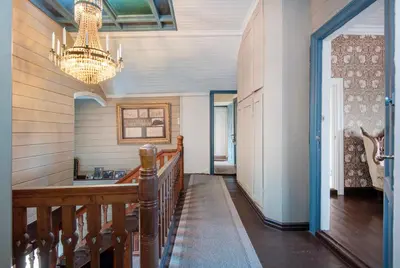 a hallway of a home with a chandelier at Jervell 2 BnB in Ålesund