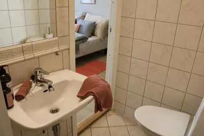 a bathroom with a sink and a toilet at One-bedroom apartment close to NTNU and St Olavs in Trondheim