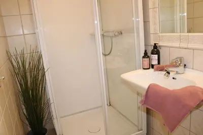 a bathroom with a shower and a sink at One-bedroom apartment close to NTNU and St Olavs in Trondheim
