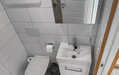 a small bathroom with a sink and a toilet at Nice Home In Lysøysundet With Wifi in Lysøysund