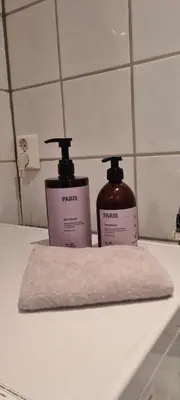 two bottles of soap sitting on a bathroom counter at Fjord view in centre with parking in Ålesund