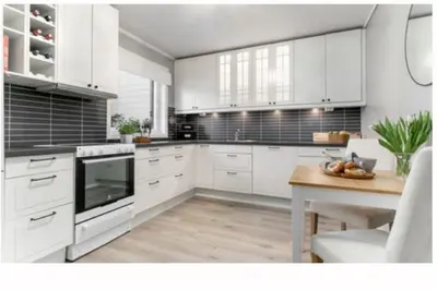 a white kitchen with white cabinets and a table at Entire house less than 2 km from Granåsen, WC 2025 in Trondheim