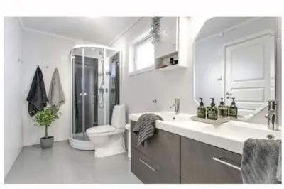 a white bathroom with a toilet and a sink at Entire house less than 2 km from Granåsen, WC 2025 in Trondheim