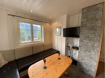 a living room with a couch and a table at Ruud Tun in Hafjell