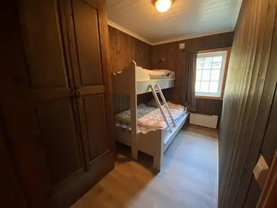 a small room with a bunk bed and a window at Ruud Tun in Hafjell