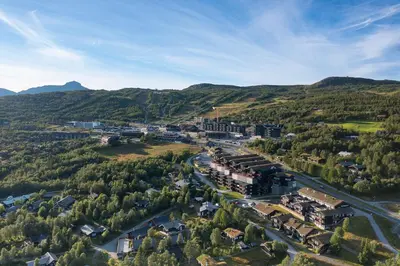an aerial view of a town in the mountains at Stølstunets toppetasje in Beitostøl