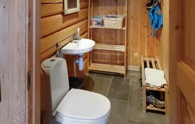 a bathroom with a white toilet and a sink at 2 Bedroom Lovely Home In Oppdal in Oppdal