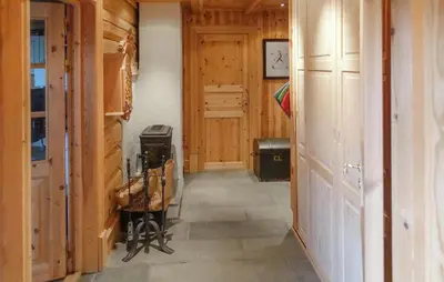 a hallway of a house with wooden walls at 2 Bedroom Lovely Home In Oppdal in Oppdal