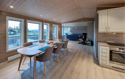 a kitchen and dining room with a table and chairs at Gorgeous Home In Svingvoll With Wifi in Svingvoll