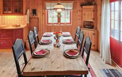 a wooden table in a kitchen with a dining room at Stunning Home In Rjukan With Sauna in Rjukan
