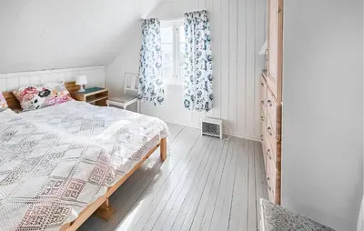 a bedroom with a bed and a window at 3 Bedroom Amazing Home In Sula in Sula