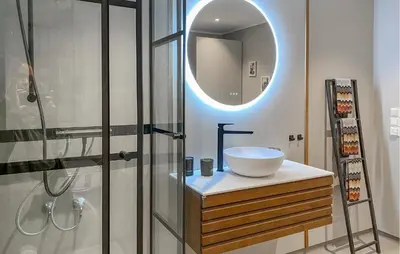 a bathroom with a sink and a mirror at Gorgeous Home In Sørbøvågen With Wifi in Saltbu