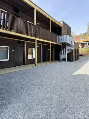 a building with a staircase in front of it at Modern apartment with two bedrooms in Moelv