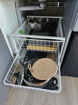 a drawer in a refrigerator filled with pots and pans at WayCamp Tustna in Leira