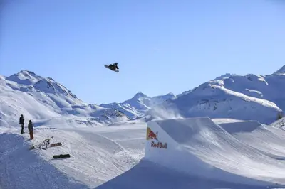 a plane flying over a snow covered mountain at Modern cabin in Vestlia - EV Type 2 - Sauna - WiFi - Games in Geilo