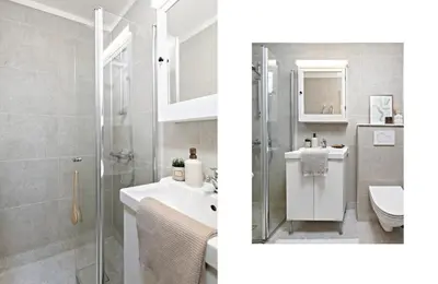 a bathroom with a shower and a sink and a toilet at Koselig leilighet ved Solsiden in Trondheim