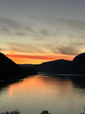 a view of a lake at sunset at Olden Apartment with Panorama view in Olden