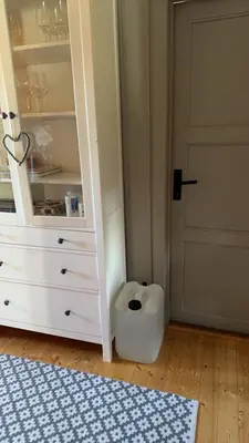 a closet with a white dresser and a door at Øyangen 3 in Rogne