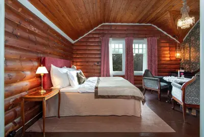 a bedroom with a bed in a log cabin at Jervell 1 Bnb in Ålesund
