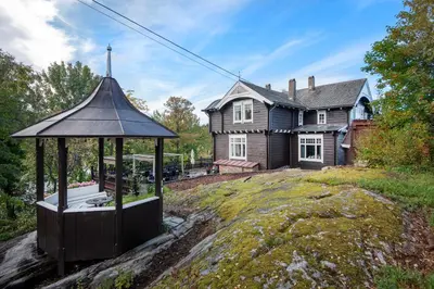 a gazebo in front of a house at Jervell 1 Bnb in Ålesund
