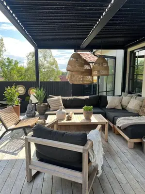 a patio with couches and tables on a deck at Vakreste plass og beliggenhet! in Trondheim